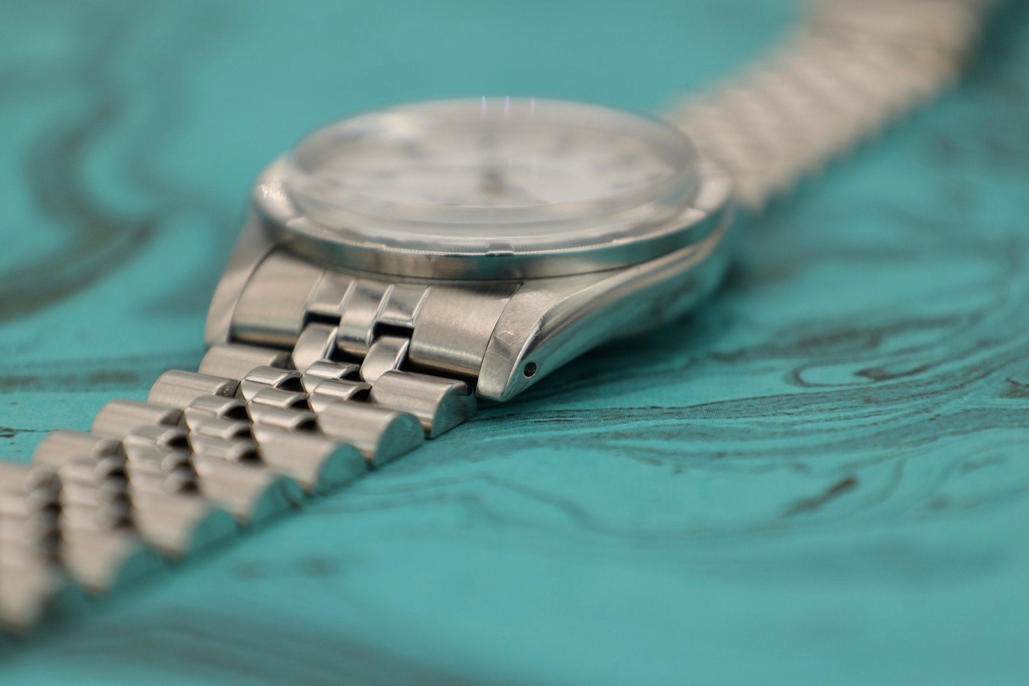 1988 Rolex Date Ref. 15010 White Roman Dial | Jubilee Bracelet - Sierra Time Co