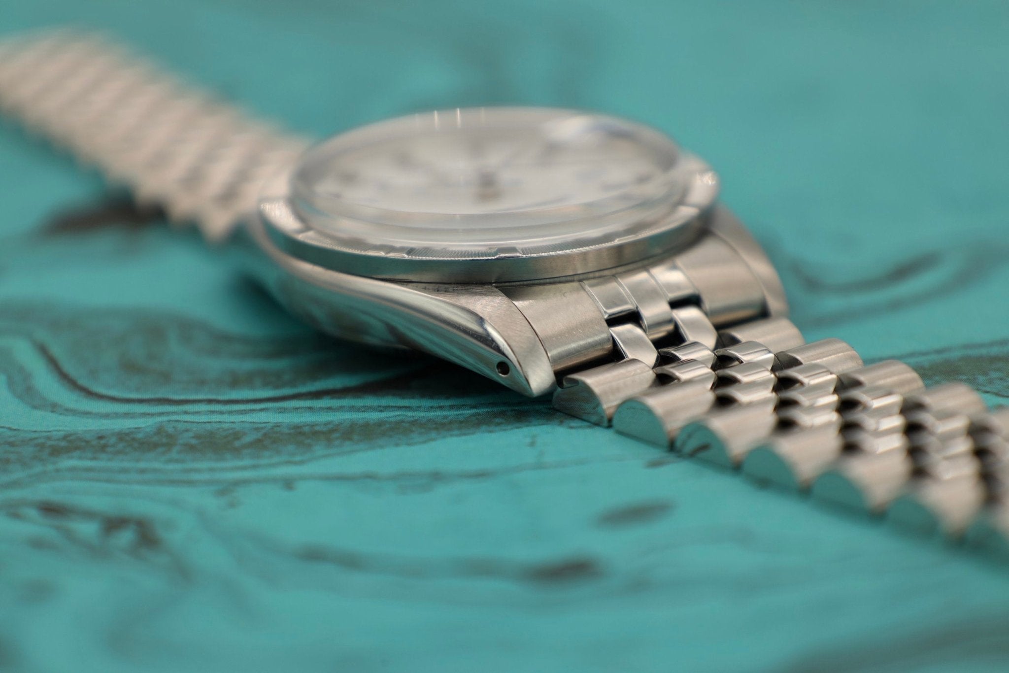 1988 Rolex Date Ref. 15010 White Roman Dial | Jubilee Bracelet - Sierra Time Co