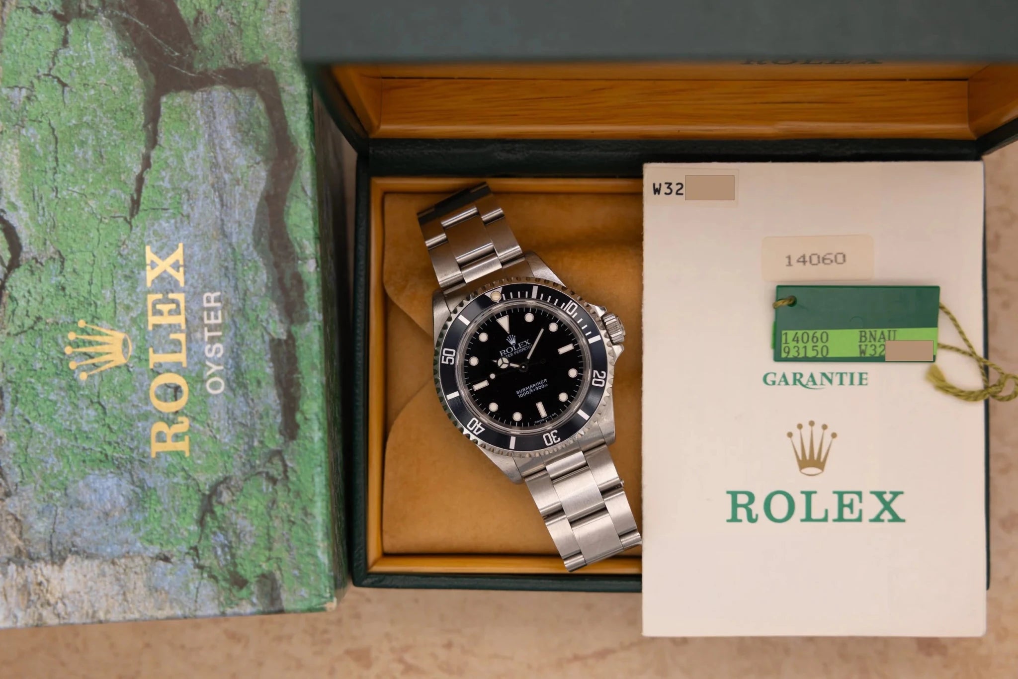 1995 Rolex Submariner Ref. 14060 | Tritium Dial | Navy Blue Bezel | Box and Papers - Sierra Time Co