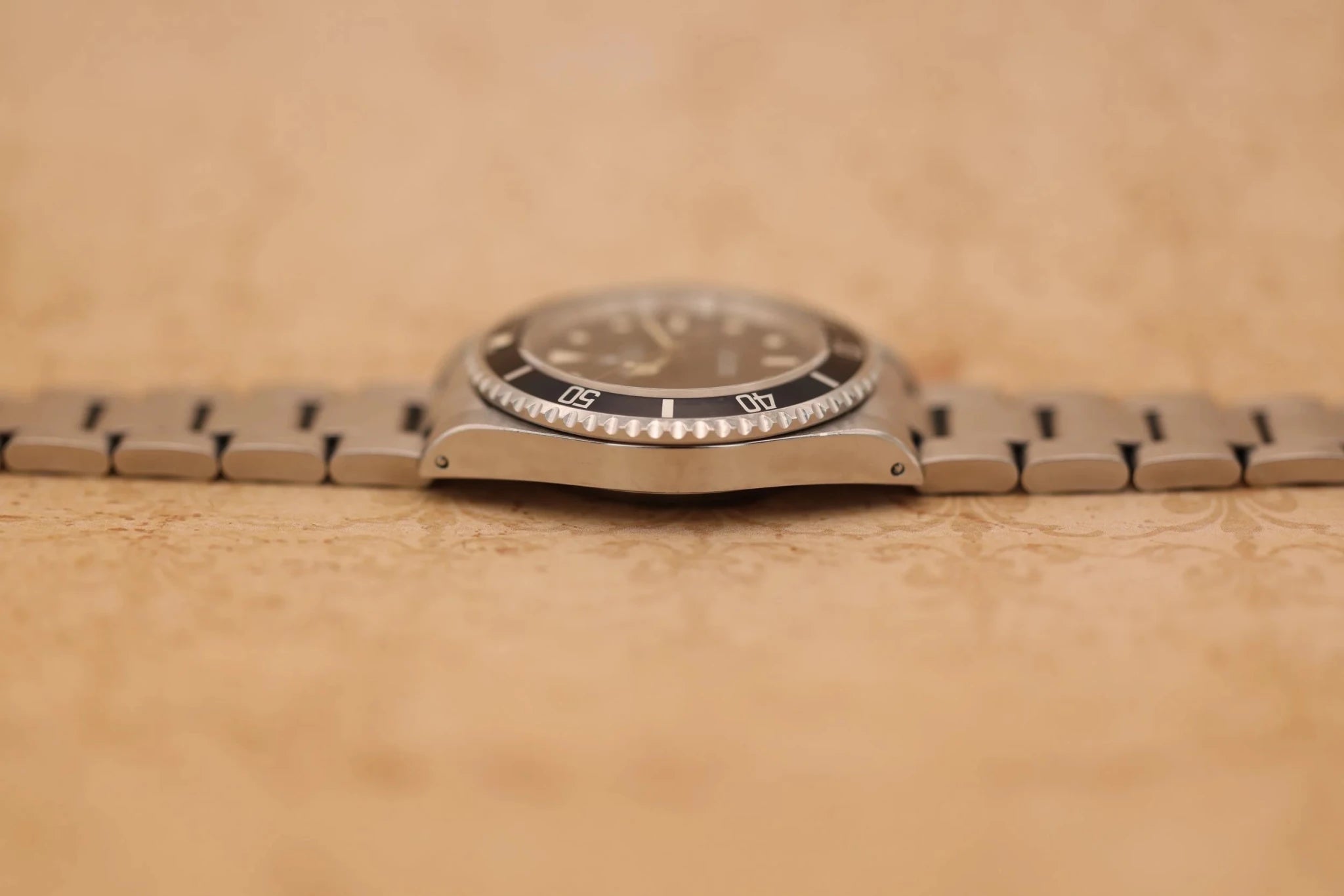 1996 Rolex Submariner Ref. 14060 | Creamy Patina | Box and Papers - Sierra Time Co