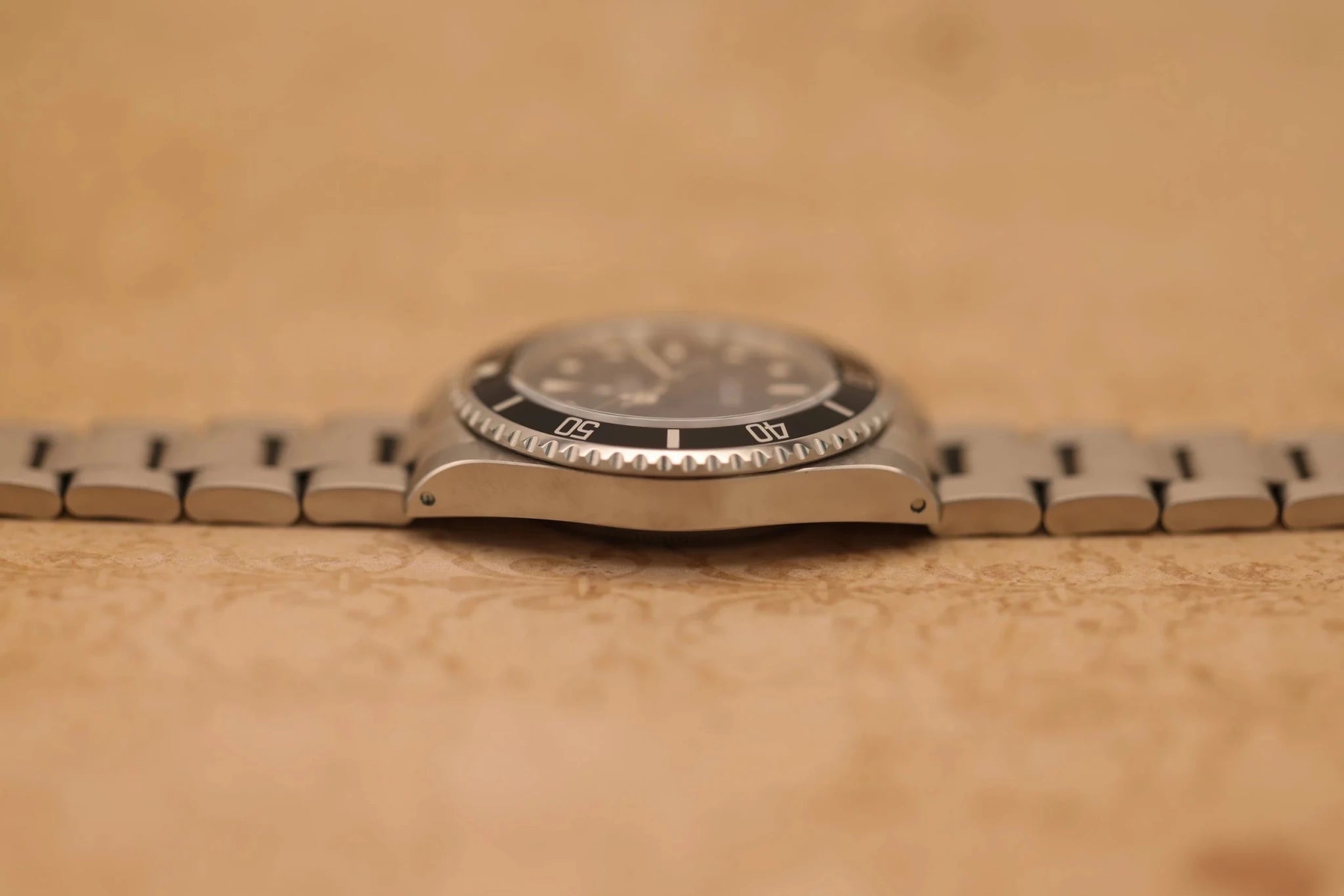 1996 Rolex Submariner Ref. 14060 | Creamy Patina | Papers - Sierra Time Co
