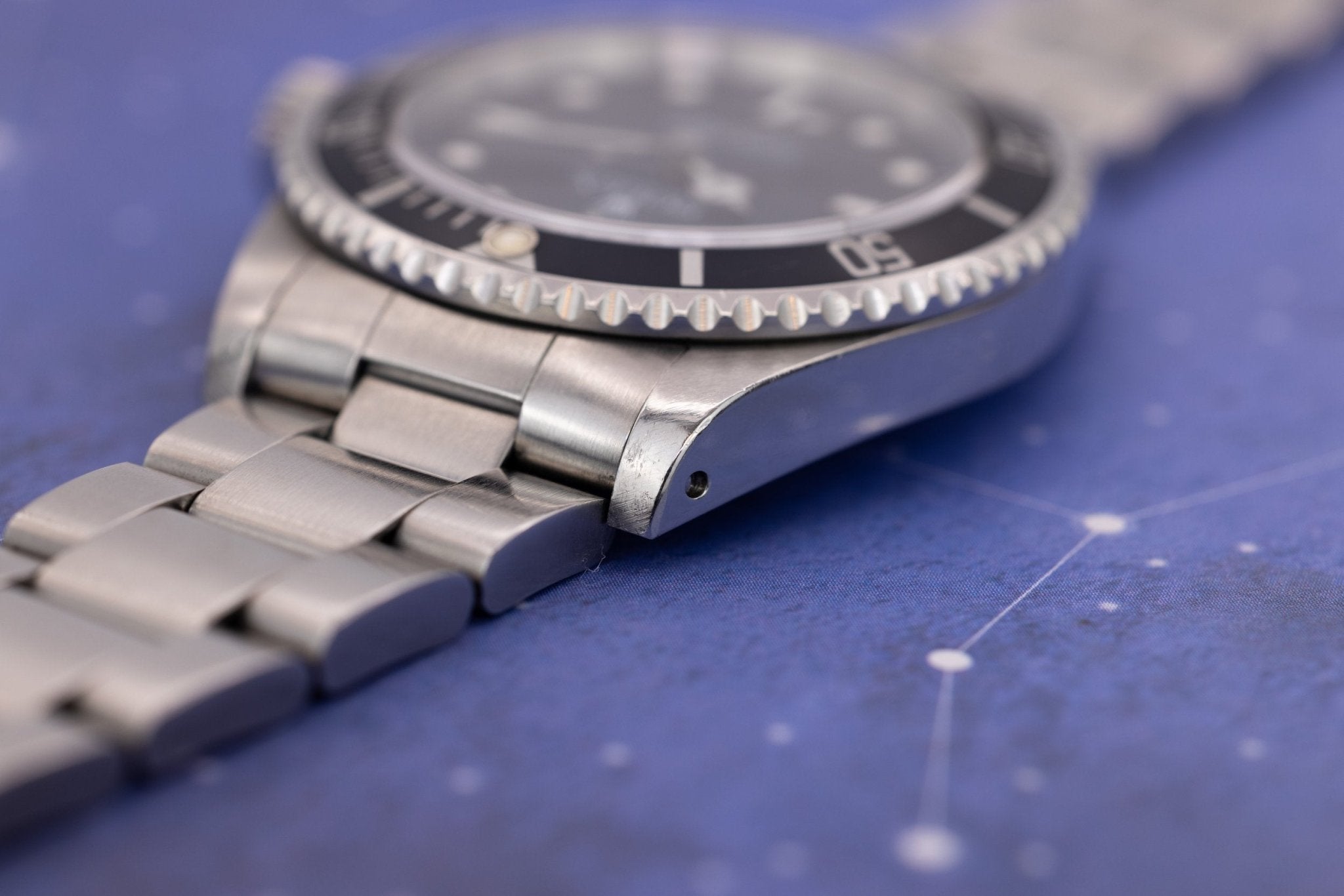 1997 Rolex Submariner Ref. 14060 | Tritium Dial | Navy Blue Bezel | Box and Papers - Sierra Time Co
