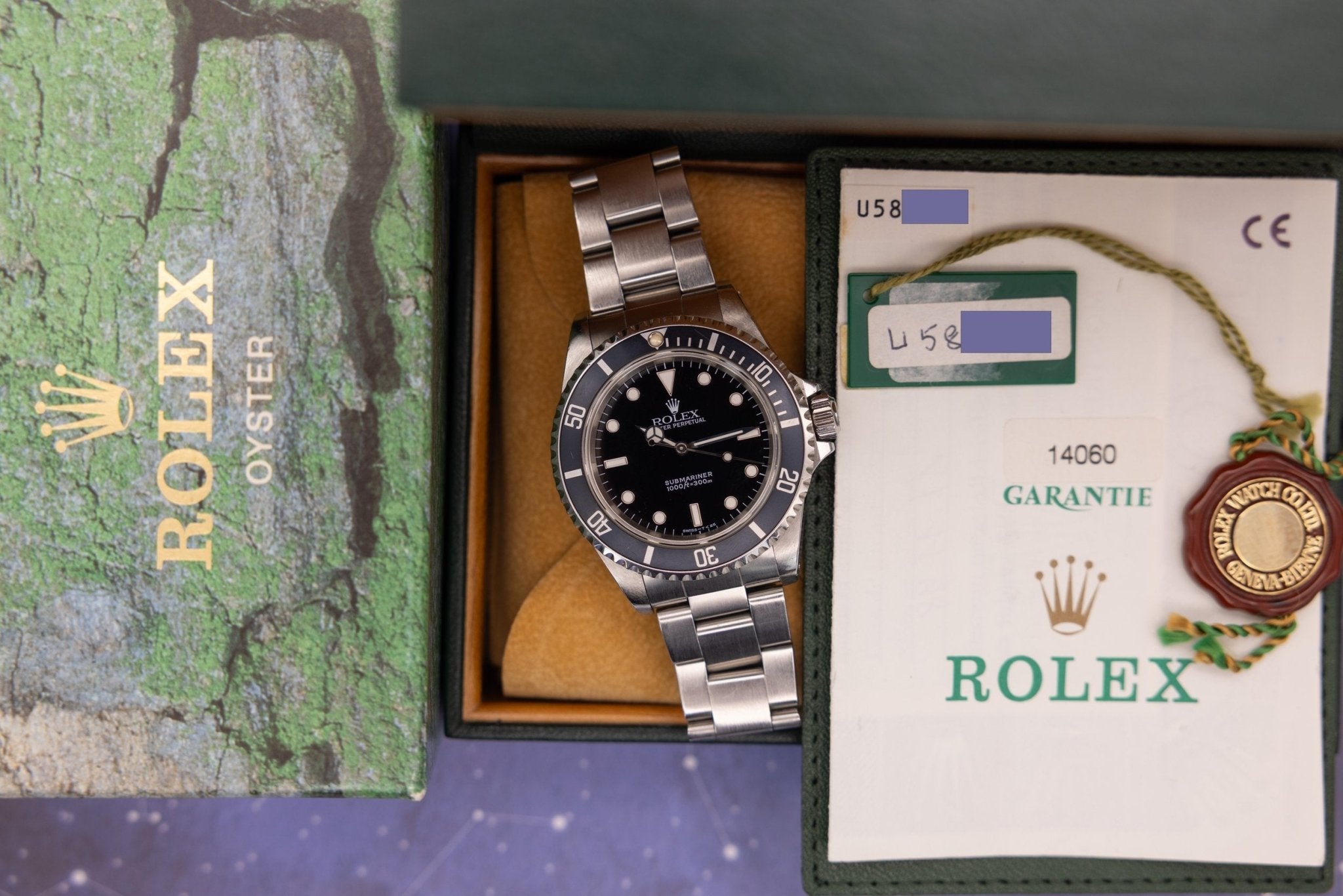 1997 Rolex Submariner Ref. 14060 | Tritium Dial | Navy Blue Bezel | Box and Papers - Sierra Time Co
